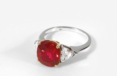 Bulgari.A diamond, platinum and 18K gold ring set with an exceptional Burma "pigeon blood" cushion shaped ruby weighing 3,87 cts