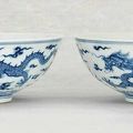 A pair of blue and white 'dragon' bowls, Daoguang six-character seal marks in underglaze-blue and of the period (1821-1850)