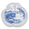 A rare blue and white and copper-red peach-shaped dish, Kangxi period (1662-1722)