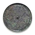 An unusual  bronze circular 'zigzag'-pattern mirror. Late Warring States Period, 4th-3rd century BC