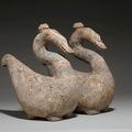 A rare pair of painted pottery goose-form vessels and covers, Han dynasty (206 BC-AD 220)