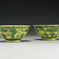 A pair of yellow-ground green-enameled 'Boys' bowls, Yongzheng marks and period (1723-1735)