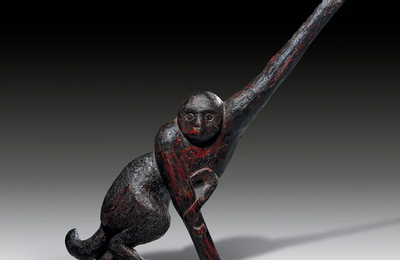 A lacquered wood figure of a monkey on a branch, late Warring States (480-221 BC)