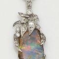 An opal and diamond pendant on chain