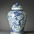 An early Kangxi underglaze blue jar and cover decorated with flaming pearls and dragons amongst flames