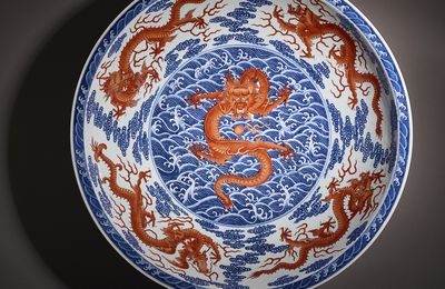 A magnificent large blue and white and iron-red 'dragon' dish, Qianlong seal mark in underglaze blue and of the period (1736-1795)