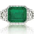 An emerald and diamond brooch