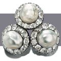 Exceptionally large natural pearls: A pair of natural pearl and diamond earrings & A natural pearl and diamond ring