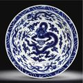 A rare large blue and white "dragon" dish. Yongzheng mark and period