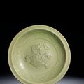 A Longquan celadon carved and moulded 'Dragon' dish, Yuan dynasty (1279-1368)