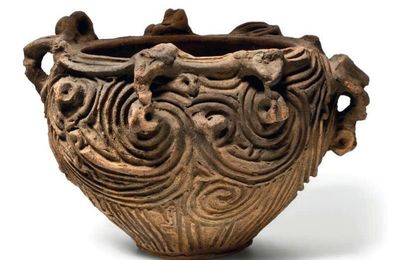 An earthenware vessel with sculptural rim, Late Jomon period (5th - 3rd century BC)