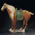 A rare large sancai-glazed pottery figure of a caparisoned horse, Tang dynasty (AD 618-907)