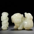 A white jade lion group and a fisherman, Qing dynasty, 18th century