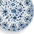 A finely painted blue and white barbed 'Floral' charger, Ming dynasty, Yongle period (1403-1425)