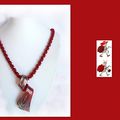 538. pendentif rouge torsadé sur chaine rouge 30€