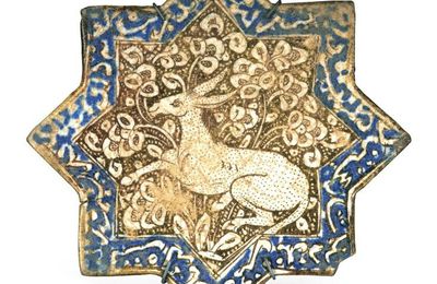 A Kashan lustre pottery star tile, Persia, circa 1300