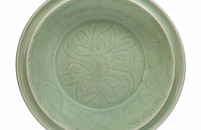 A carved Longquan celadon dish, Ming dynasty (1368-1644)