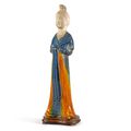 A rare and beautifully modelled blue and amber-glazed pottery figure of a court lady, Tang dynasty (618-907)