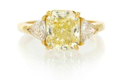 An 18 Karat Yellow Gold, Fancy Intense Yellow Diamond and Diamond Ring, Cartier