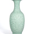 A large very rare moulded and carved celadon-glazed vase, Qianlong six-character seal mark and of the period (1736-1796)