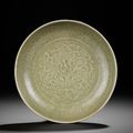 A Longquan celadon moulded 'lotus' dish, Ming dynasty, late 14th-early 15th century