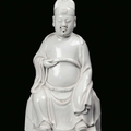 A Blanc de Chine porcelain sitting Dignitary, China, Dehua, Qing Dynasty, 18th century