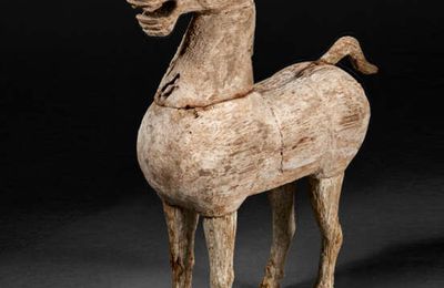 A rare small wood figure of a standing horse, Han dynasty (206 BC-AD 220)