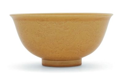 A yellow-glazed incised 'dragon' bowl, Qianlong six-character seal mark in underglaze blue and of the period (1736-1795)