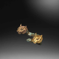 A rare pair of small gilt-bronze tiger-head terminals, Qin Dynasty (221-207 BCE)