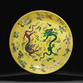 A rare large yellow, green and aubergine-glazed 'dragon' dish, Kangxi six-character mark and of the period (1662-1722)