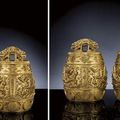 An exceptionally rare pair of imperial gilt-bronze 'dragon' ritual bells, bianzhong. Kangxi cast marks, corresponding to 1715