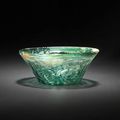 A moulded glass Bowl . Persia, 10th/ 11th Century