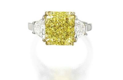 Platinum, 18 karat gold, fancy vivid yellow diamond and diamond ring