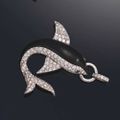 A diamond, ebony and sapphire dolphin pendant, by René Boivin