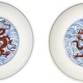 A fine pair of underglaze blue and iron-red 'dragon' dishes, Qianlong seal marks and period (1736-1795)