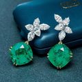 A pair of 30.86 and 31.24 carat Colombian emerald and diamond ear pendants, by Jacques Timey for Harry Winston