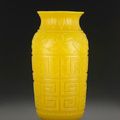 A large carved opaque yellow glass vase, 19th century
