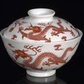 A very rare iron-red-decorated sgraffiato-ground 'dragon' bowl and cover, underglaze blue six-character sealmarks Qianlong