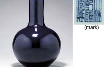 A fine large blackish-blue-glazed globular bottle vase, Qianlong seal mark in underglaze blue and of the period (1736-1795)