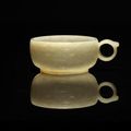 A pale green jade cup, Ming Dynasty (1368-1644)