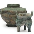 A chinese globular bronze vessel wtih ring handles, fu, and a tripod vessel, li ding, Zhou dynasty (1100- 256 bc)