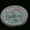 A silver-plated bronze mirror, China, Han Dynasty, 2nd century