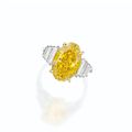 Fancy Vivid Yellow diamond and diamond ring