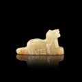 A white and russet jade 'mythical beast' pendant, Liao–Jin dynasty (907-1234)