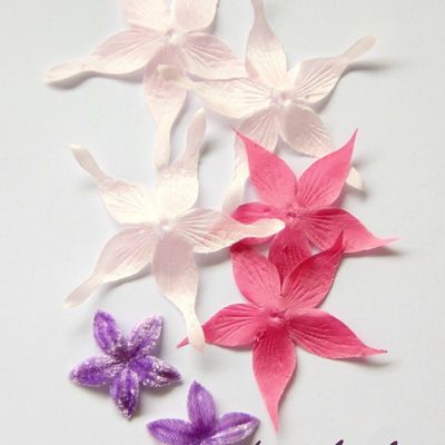 Fleurs en soie, nuances de roses, parme...