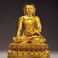 A fine and very rare early Ming gilt-bronze seated figure of Bhaishajiyaguru, Yongle mark and period (1403-1424)