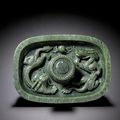A spinach jade 'Dragon' cupstand, Qing dynasty, Qianlong period (1736-1795)