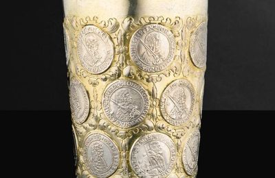 A German parcel-gilt silver coin beaker, Gottfried Schmidt, Leipzig, circa 1680