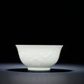 A fine and rare moulded white-glazed 'Prunus blossom' bowl, Qing dynasty, 18th century 