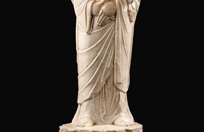 A finely carved white marble standing figure of a monk, probably Ananda, Tang dynasty (618-907)